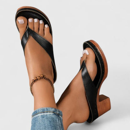 Orthopedic women's heels featuring an ergonomic footbed and shock-absorbing sole, designed in elegant synthetic leather for comfort and style. 1