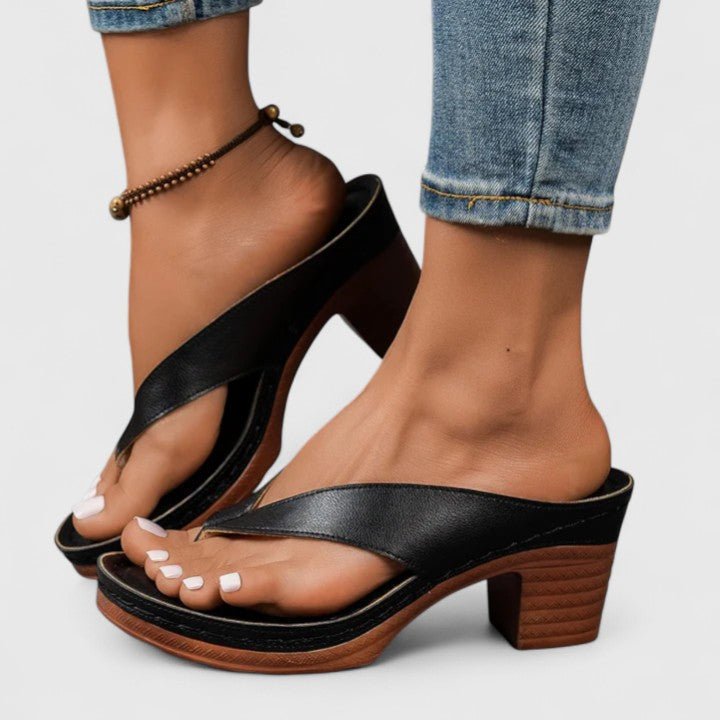 Orthopedic women's heels featuring an ergonomic footbed and shock-absorbing sole, designed in elegant synthetic leather for comfort and style. 0
