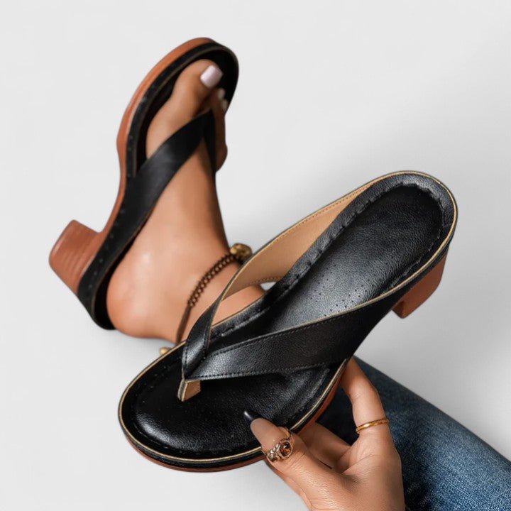 Orthopedic women's heels featuring an ergonomic footbed and shock-absorbing sole, designed in elegant synthetic leather for comfort and style. 2