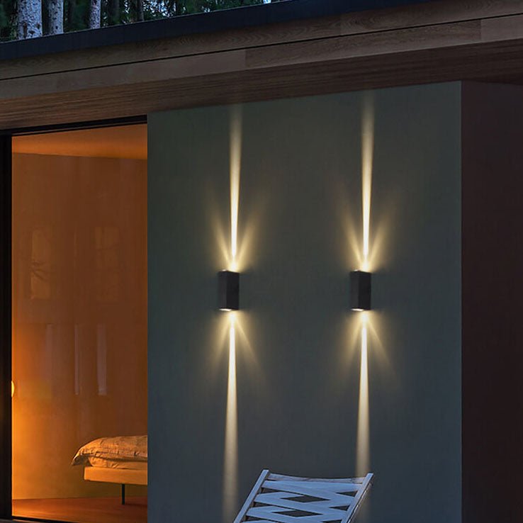 Outdoor LED wall lamp in sleek black design, featuring an up-down light effect, perfect for modern facade lighting and enhancing outdoor spaces. 1