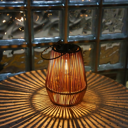 Elegant outdoor solar lanterns featuring a woven design, perfect for eco-friendly lighting in gardens and patios, showcasing a warm glow at night. 3