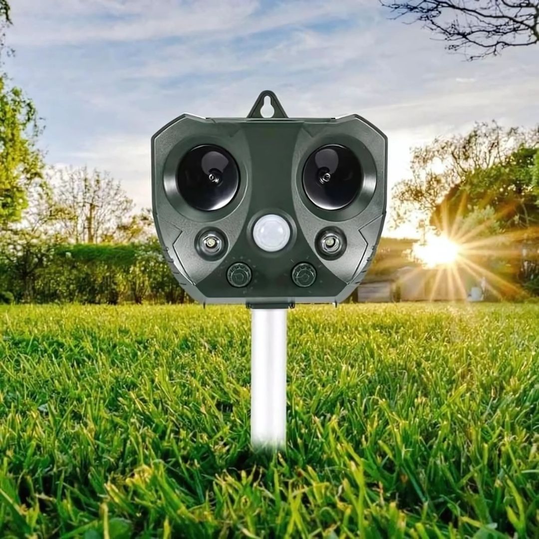 Outdoor Ultrasonic Pest Repeller featuring a PIR Motion Sensor, powered by solar and USB, designed with a weather-resistant casing for effective pest control in gardens 0