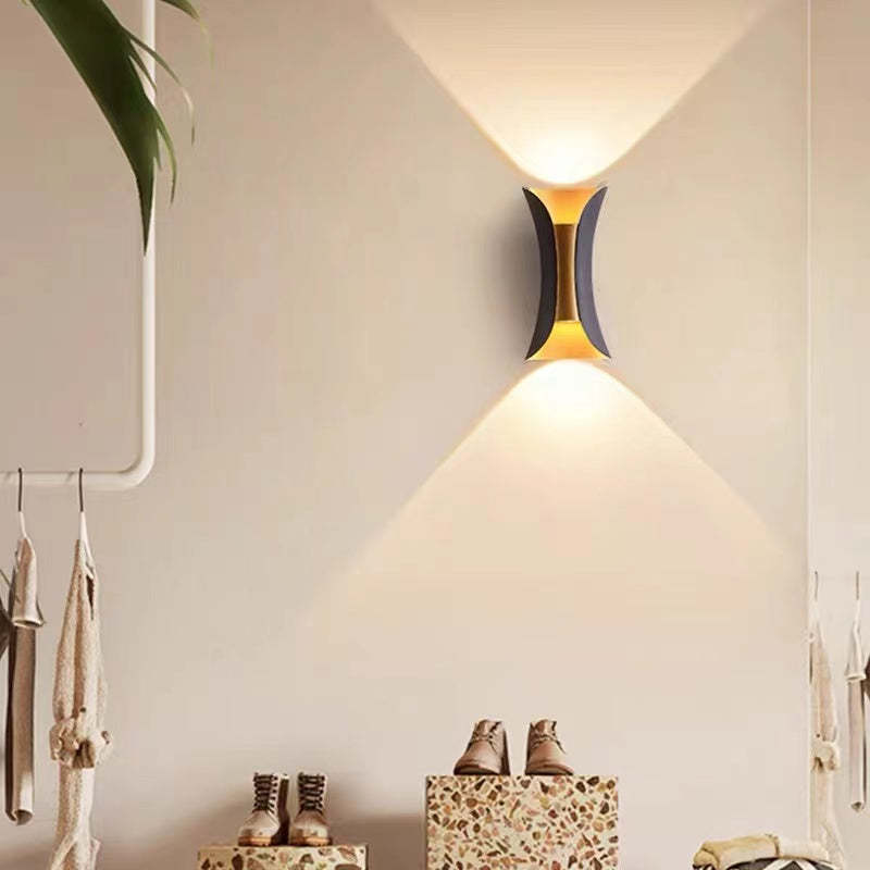 Outdoor wall lamp featuring a sleek curved design, dual LED emission, and a weather-resistant IP65 rating, ideal for enhancing exterior lighting in gardens and patios 5
