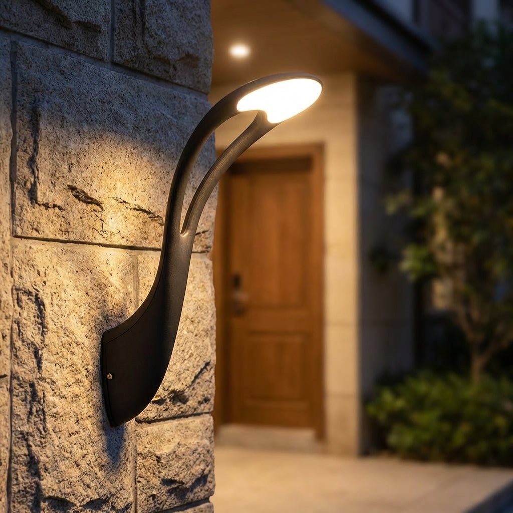 Outdoor wall lamp featuring energy-efficient LED lighting, crafted from black aluminum for weather resistance, perfect for illuminating entryways and patios. 1
