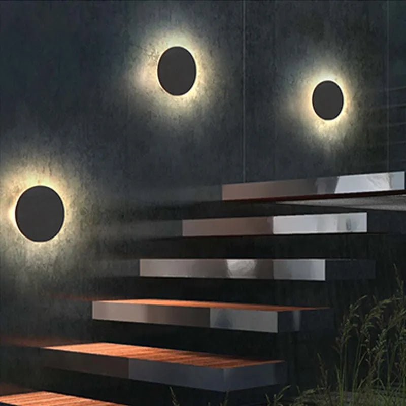 Modern outdoor wall lamp featuring up and down lighting, crafted from weatherproof metal for durable exterior use. 6