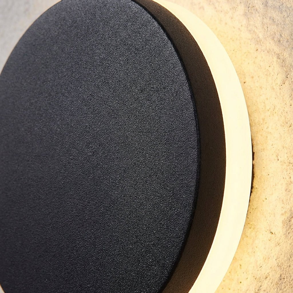 Modern outdoor wall lamp featuring up and down lighting, crafted from weatherproof metal for durable exterior use. 3