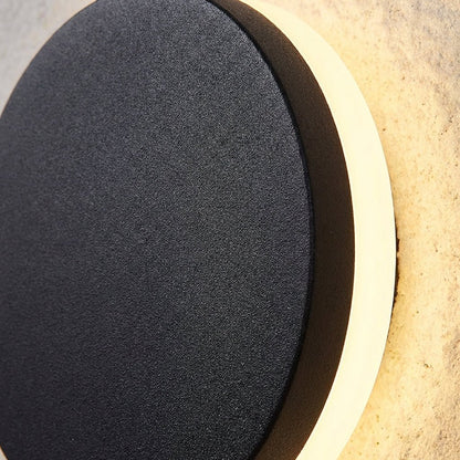 Modern outdoor wall lamp featuring up and down lighting, crafted from weatherproof metal for durable exterior use. 3
