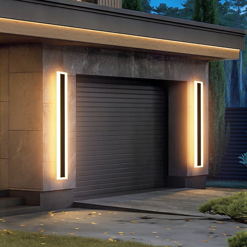Outdoor wall lamp featuring a minimalist iron design and warm white LED glow, ideal for enhancing exterior lighting in gardens, patios, and entryways. 2