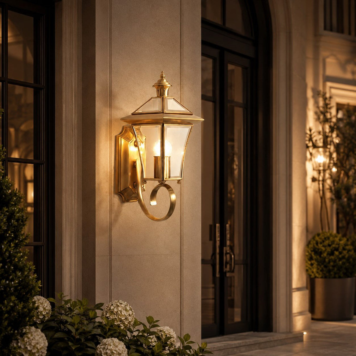 Outdoor wall lantern featuring a weatherproof brass frame and transparent glass shade, designed in a retro style, compatible with E26 LED bulbs. 0