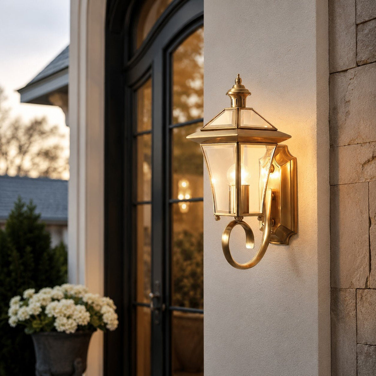 Outdoor wall lantern featuring a weatherproof brass frame and transparent glass shade, designed in a retro style, compatible with E26 LED bulbs. 3