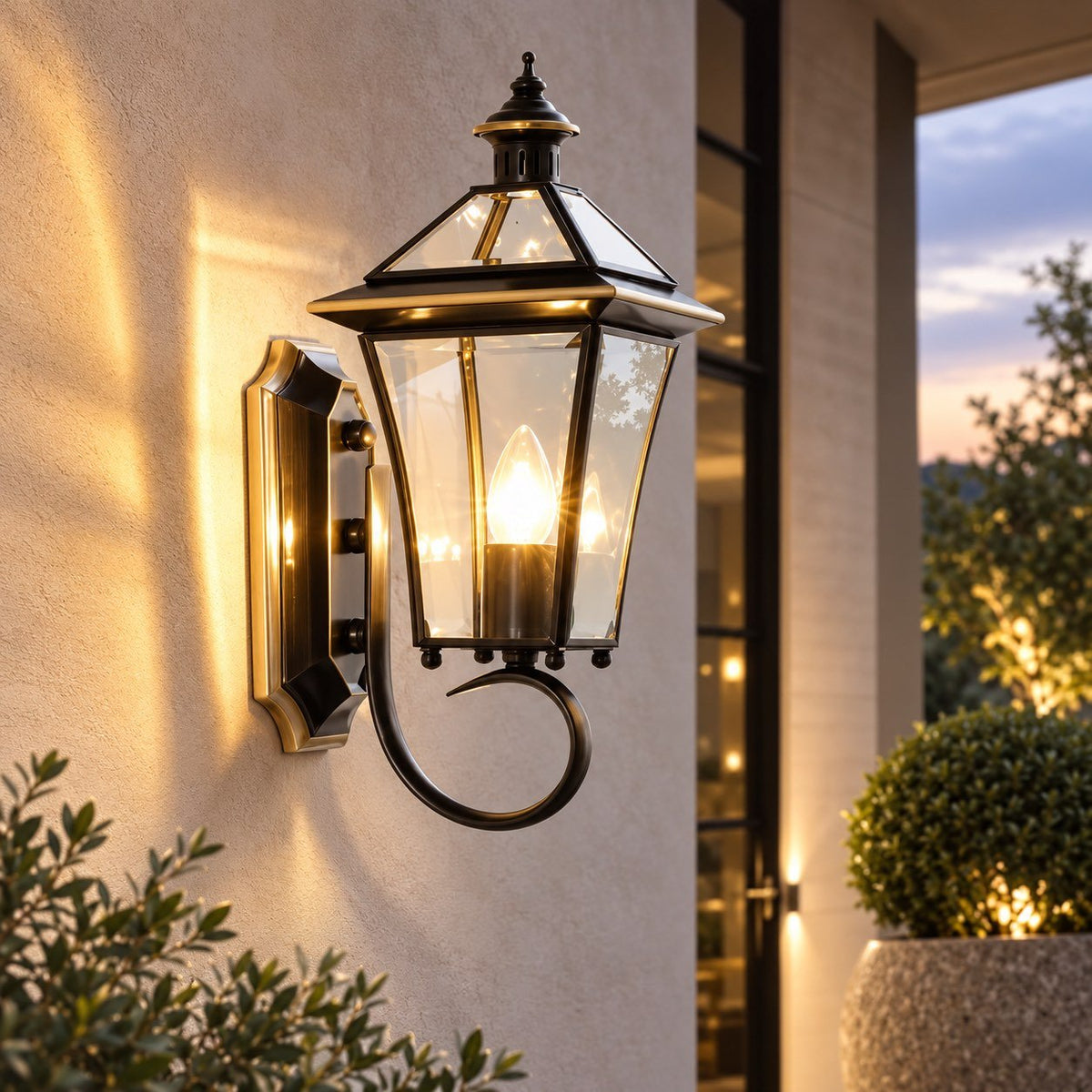Outdoor wall lantern featuring a weatherproof brass frame and transparent glass shade, designed in a retro style, compatible with E26 LED bulbs. 2