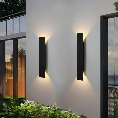 Outdoor wall lights featuring a waterproof aluminum construction and a minimalist design, showcasing a stylish bidirectional glow for enhanced outdoor ambiance. 2