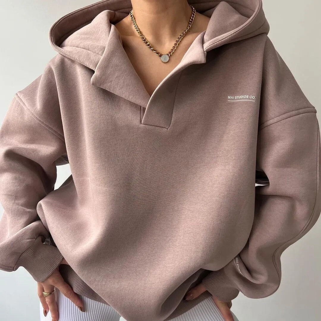 Oversized hoodie for women featuring a crossover hood, made from a soft cotton-polyester blend, perfect for casual lounge wear. 1