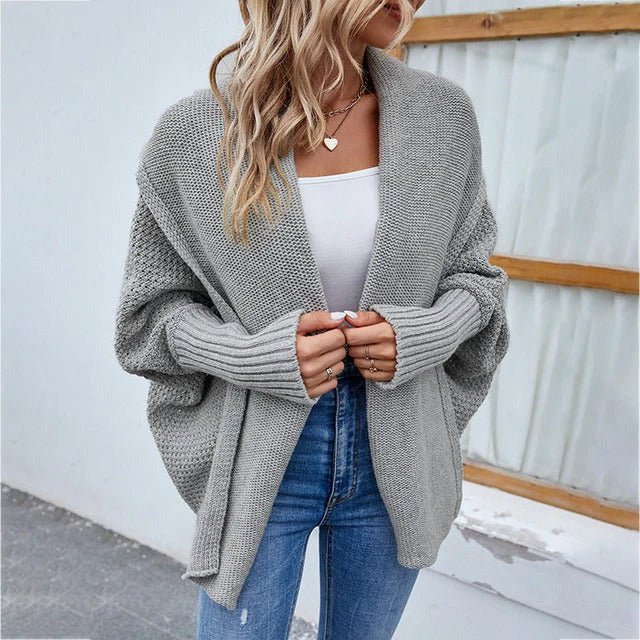 Oversized knit cardigan featuring a shawl collar and batwing sleeves, perfect for casual everyday layering for women. 0