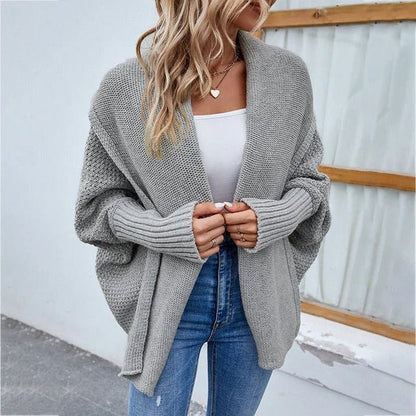 Oversized knit cardigan featuring a shawl collar and batwing sleeves, perfect for casual everyday layering for women. 0