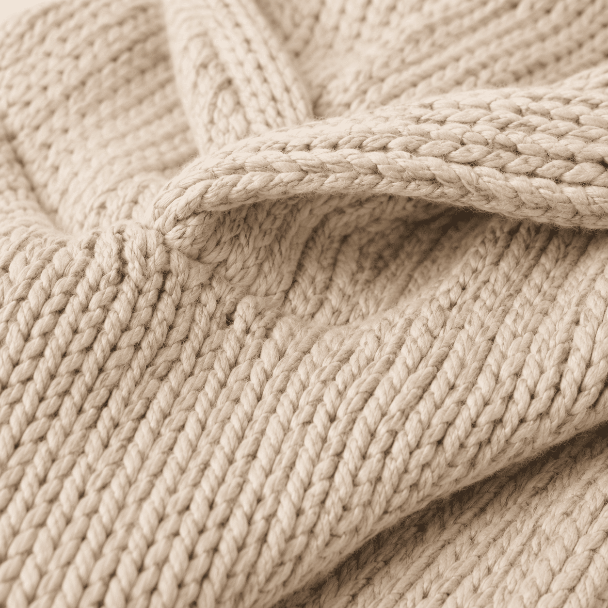 Oversized beige knit lounge hoodie with relaxed hood and chunky texture, perfect for cozy comfort and lounging at home. 2