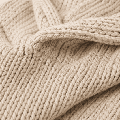 Oversized beige knit lounge hoodie with relaxed hood and chunky texture, perfect for cozy comfort and lounging at home. 2