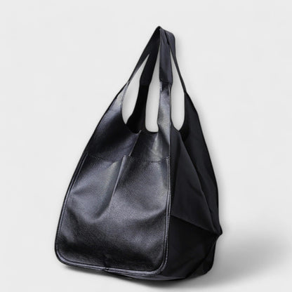Oversized shoulder bag made of durable PU leather, featuring a versatile design and elegant style, perfect for everyday use. 1