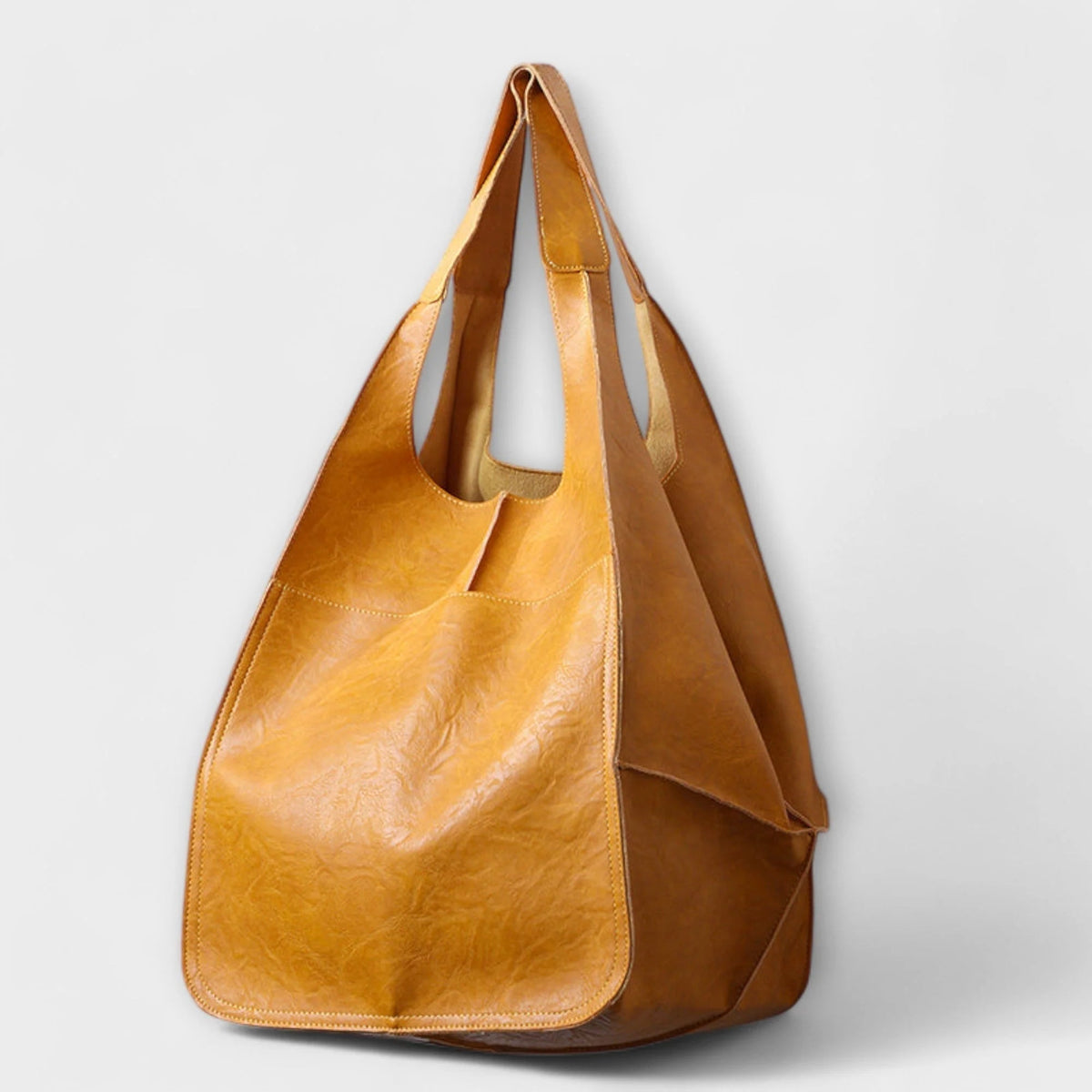 Oversized shoulder bag made of durable PU leather, featuring a versatile design and elegant style, perfect for everyday use. 0