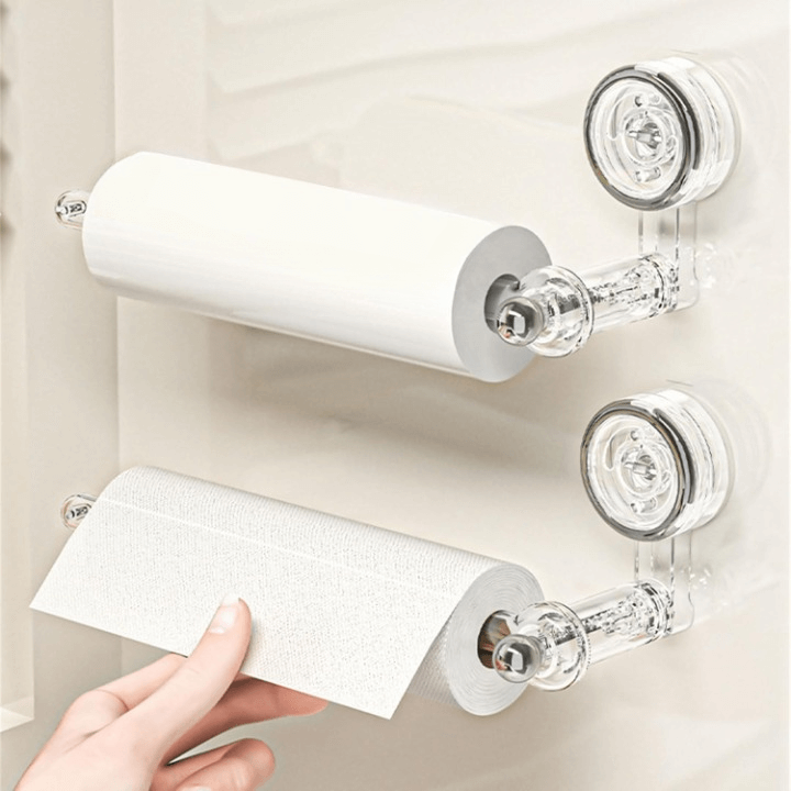 Transparent plastic wall-mounted paper towel holder with a rotatable suction cup, ideal for kitchen organization and easy access to towels. 3