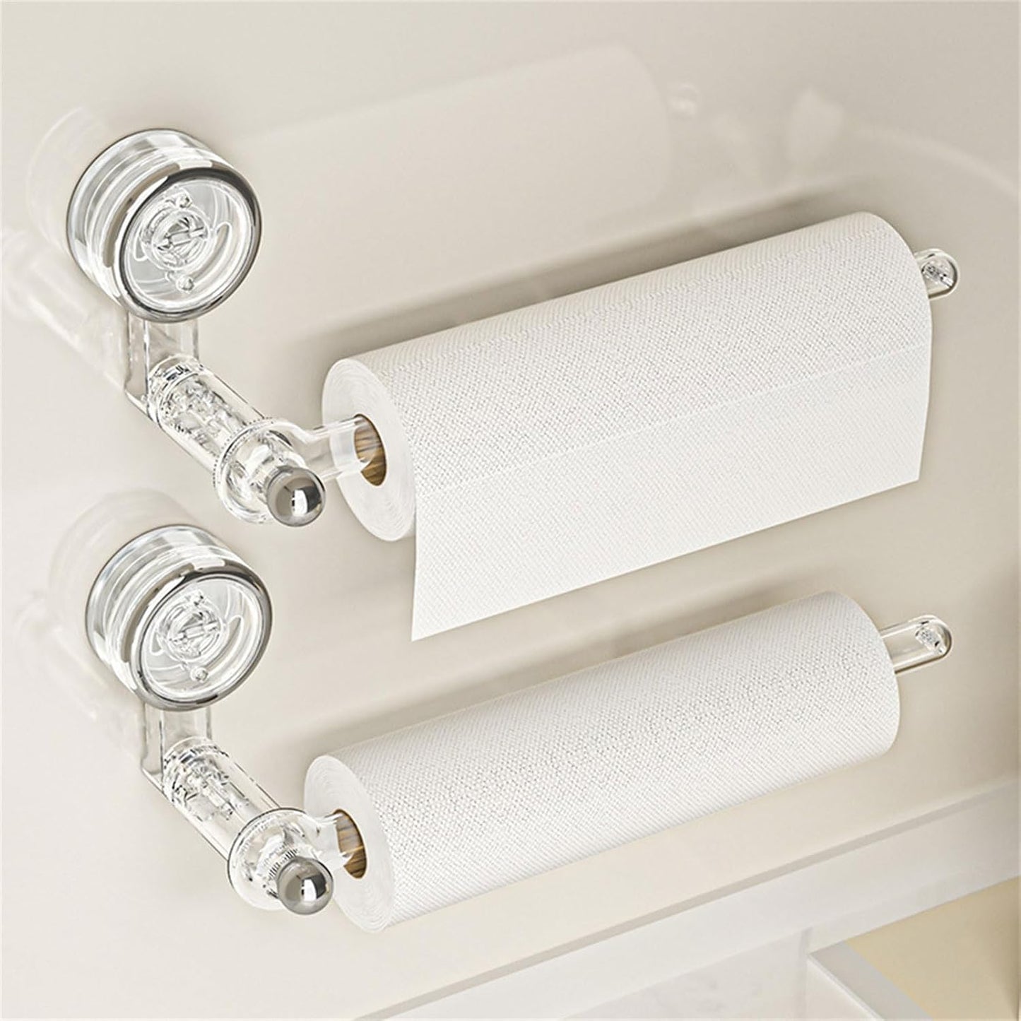 Transparent plastic wall-mounted paper towel holder with a rotatable suction cup, ideal for kitchen organization and easy access to towels. 0