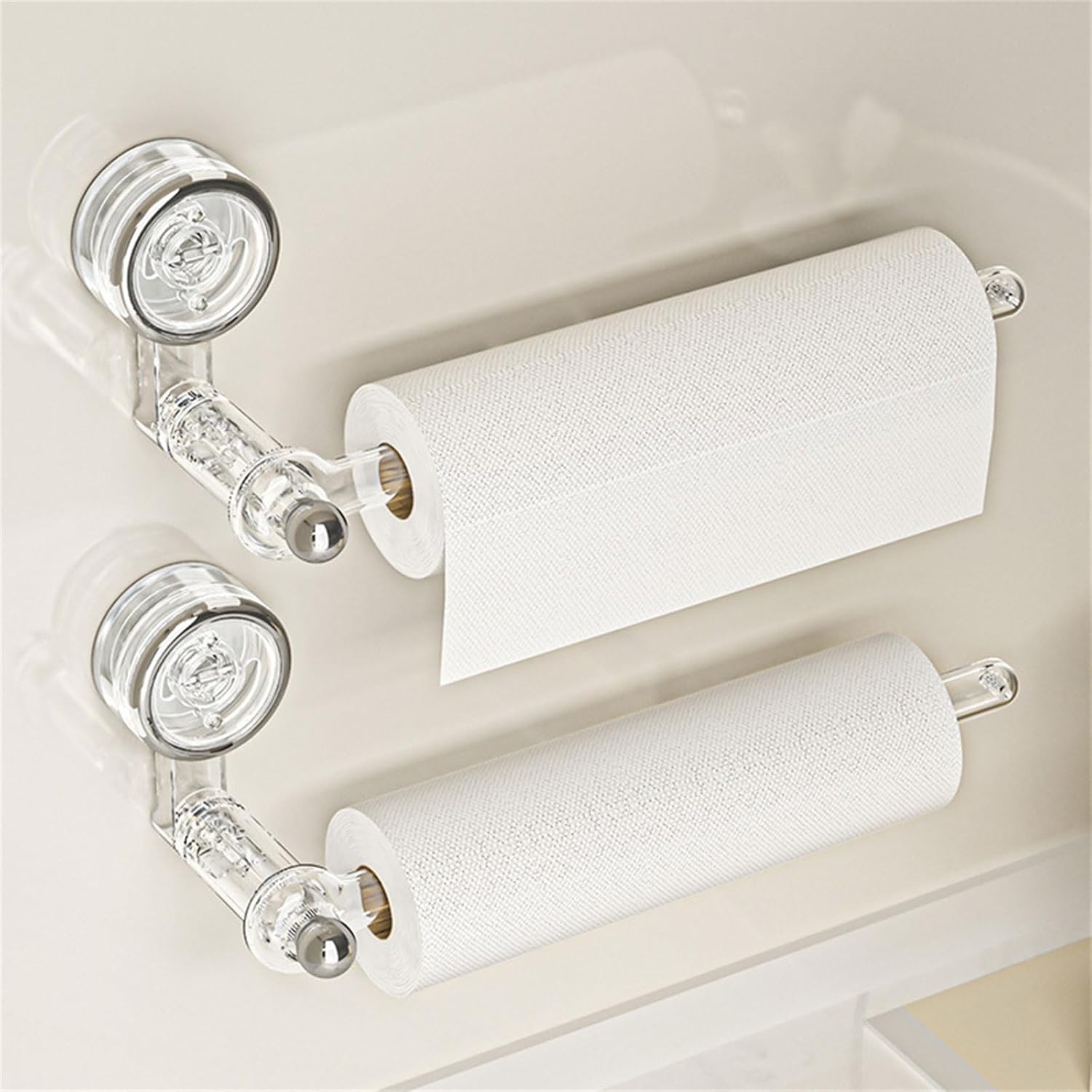 Transparent plastic wall-mounted paper towel holder with a rotatable suction cup, ideal for kitchen organization and easy access to towels. 0