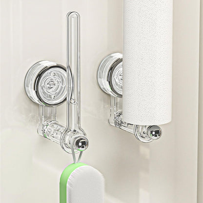 Transparent plastic wall-mounted paper towel holder with a rotatable suction cup, ideal for kitchen organization and easy access to towels. 2
