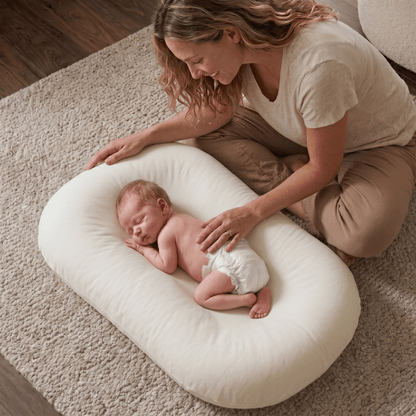 Pastel Baby Lounger Nest featuring breathable materials and raised edges for enhanced comfort and safety. 0