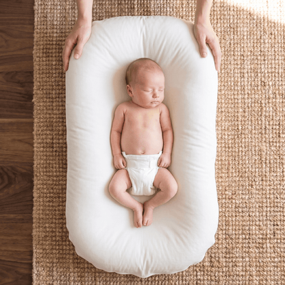 Pastel Baby Lounger Nest featuring breathable materials and raised edges for enhanced comfort and safety. 10