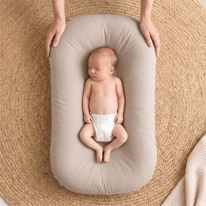 Pastel Baby Lounger Nest featuring breathable materials and raised edges for enhanced comfort and safety. 12