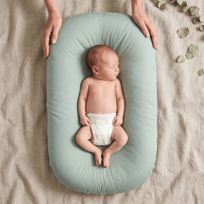 Pastel Baby Lounger Nest featuring breathable materials and raised edges for enhanced comfort and safety. 9