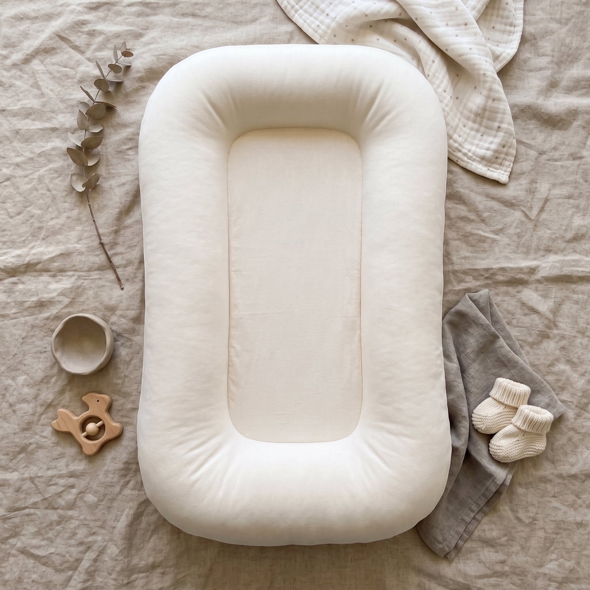 Pastel Baby Lounger Nest featuring breathable materials and raised edges for enhanced comfort and safety. 8