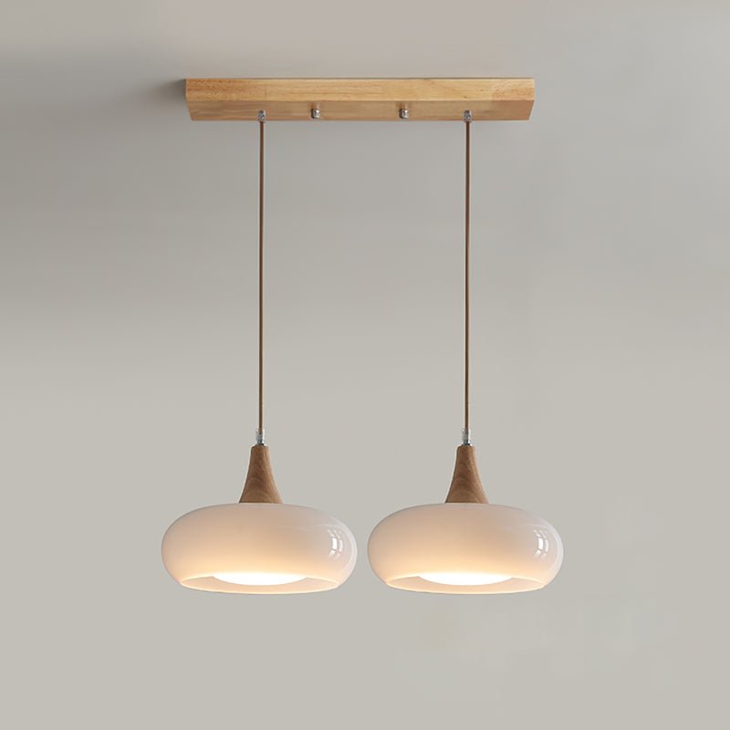 Pendant lamp featuring adjustable suspension with elegant glass shades, designed with a rustic wooden beam for a stylish and modern lighting solution. 9