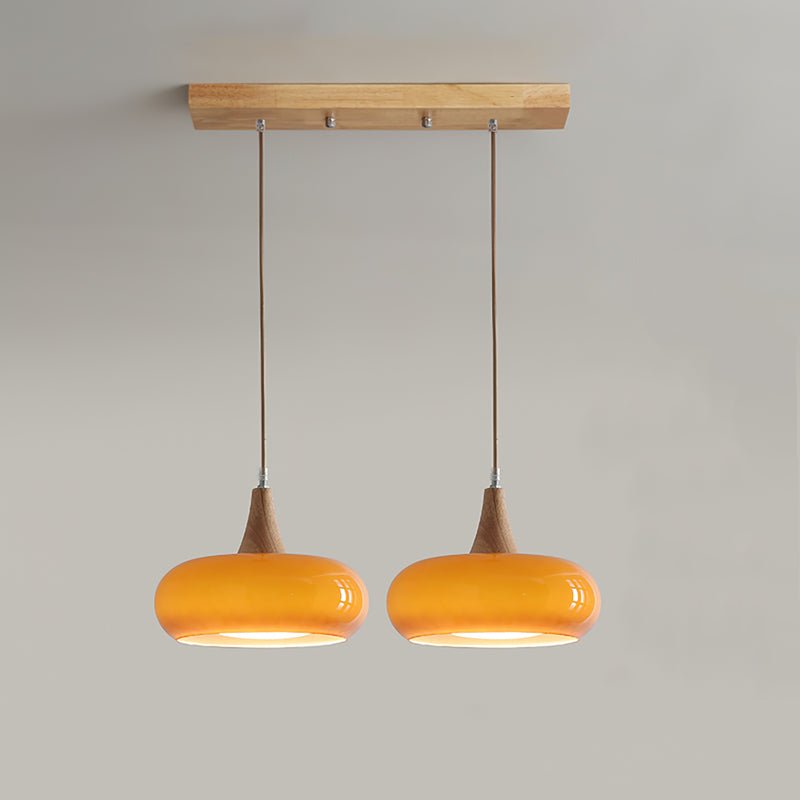 Pendant lamp featuring adjustable suspension with elegant glass shades, designed with a rustic wooden beam for a stylish and modern lighting solution. 11