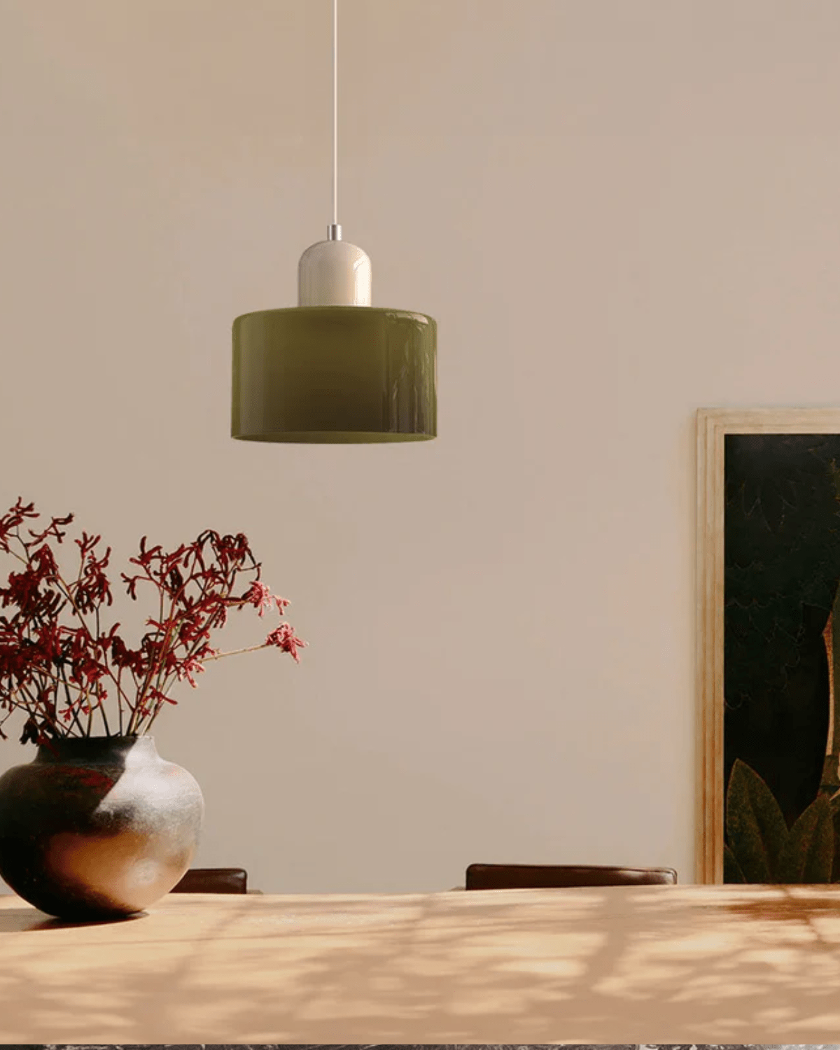 Modern pendant lamp featuring a soft glass shade in earthy tones, showcasing a sculptural design that adds a contemporary touch to any space. 4