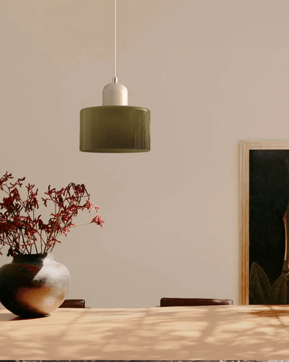 Modern pendant lamp featuring a soft glass shade in earthy tones, showcasing a sculptural design that adds a contemporary touch to any space. 4