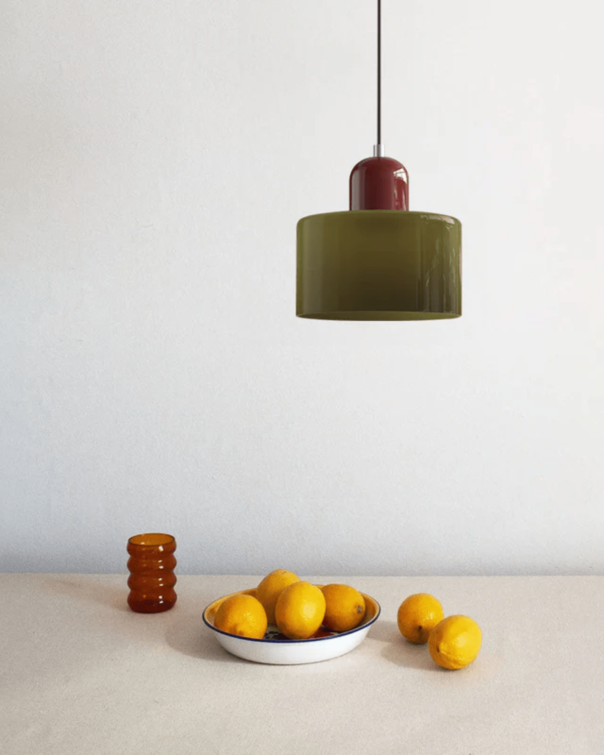 Modern pendant lamp featuring a soft glass shade in earthy tones, showcasing a sculptural design that adds a contemporary touch to any space. 7