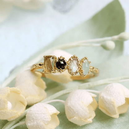 Personalized birthstone ring featuring a vintage milgrain design, customizable for family jewelry, showcasing unique birthstones in a beautiful setting. 2
