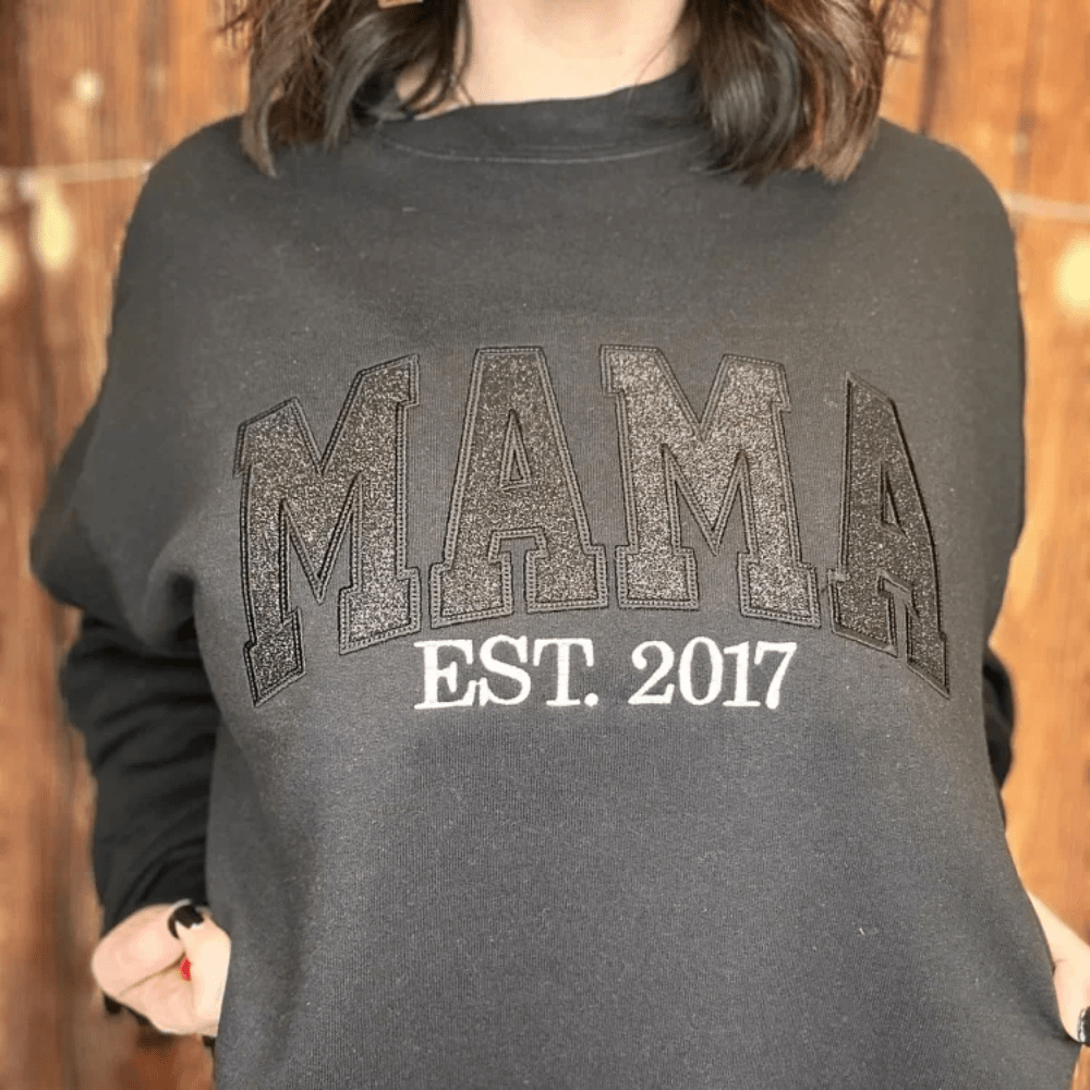 Personalized sweatshirt featuring custom name embroidery and subtle shimmer detail, designed for soft everyday wear. 0