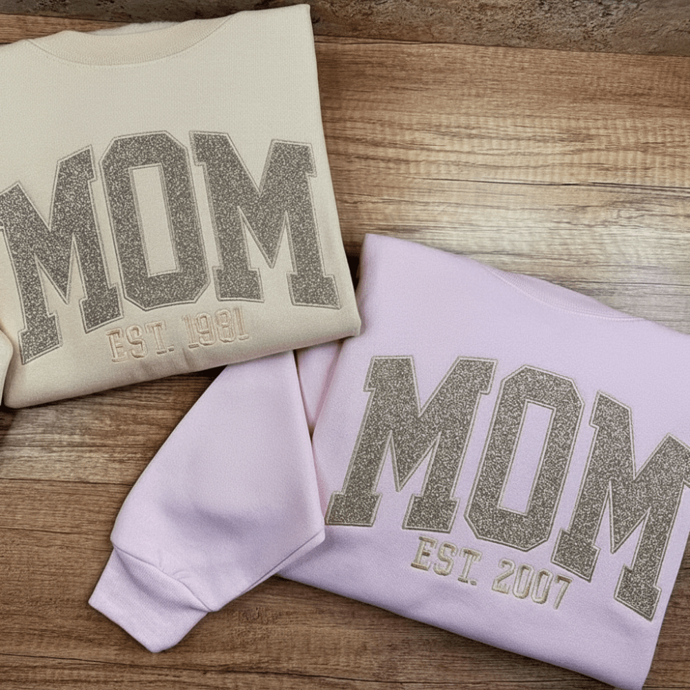 Personalized sweatshirt featuring custom name embroidery and subtle shimmer detail, designed for soft everyday wear. 5