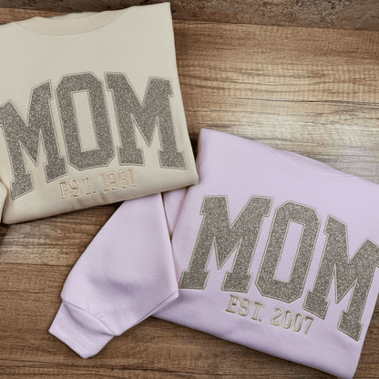 Personalized sweatshirt featuring custom name embroidery and subtle shimmer detail, designed for soft everyday wear. 5