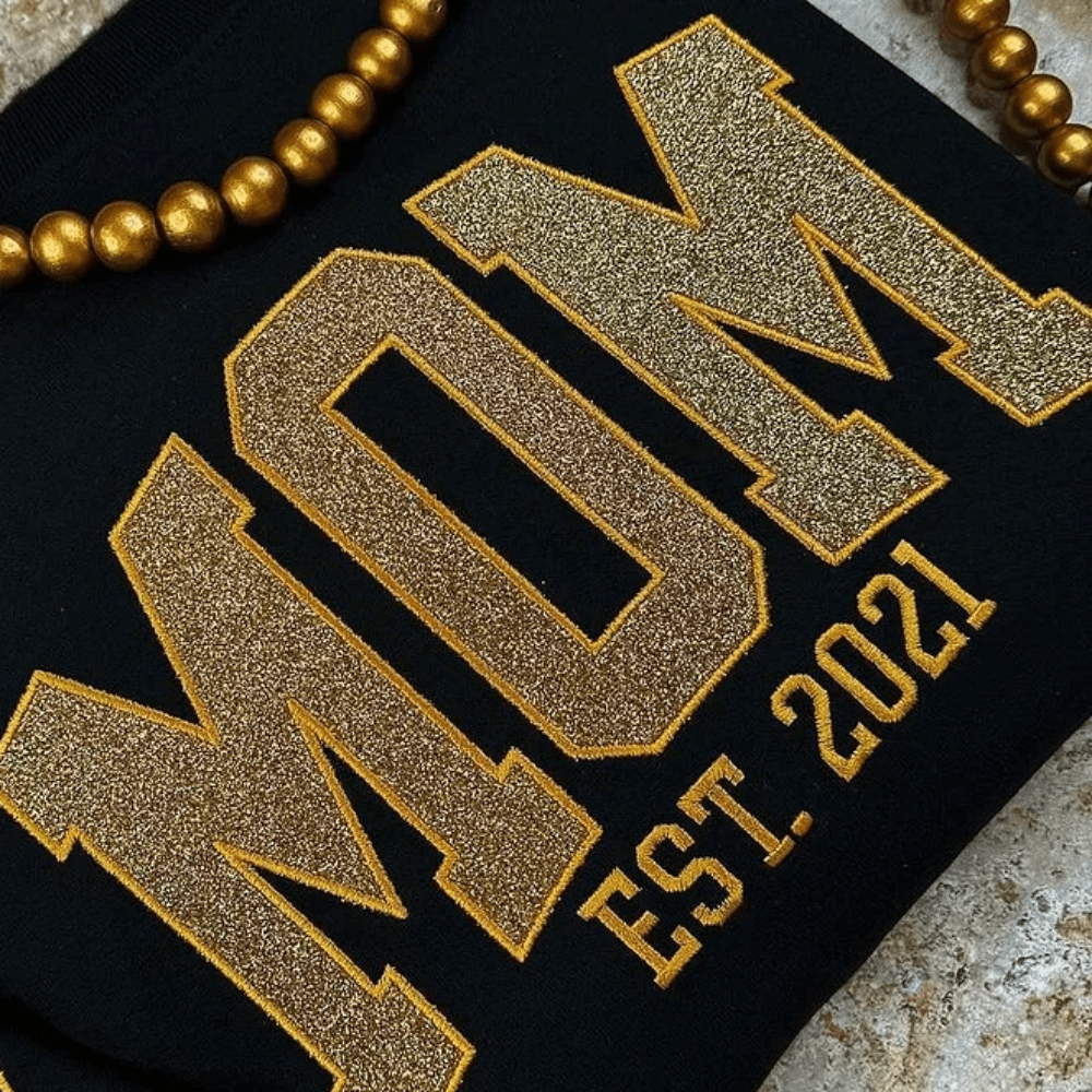 Personalized sweatshirt featuring custom name embroidery and subtle shimmer detail, designed for soft everyday wear. 3