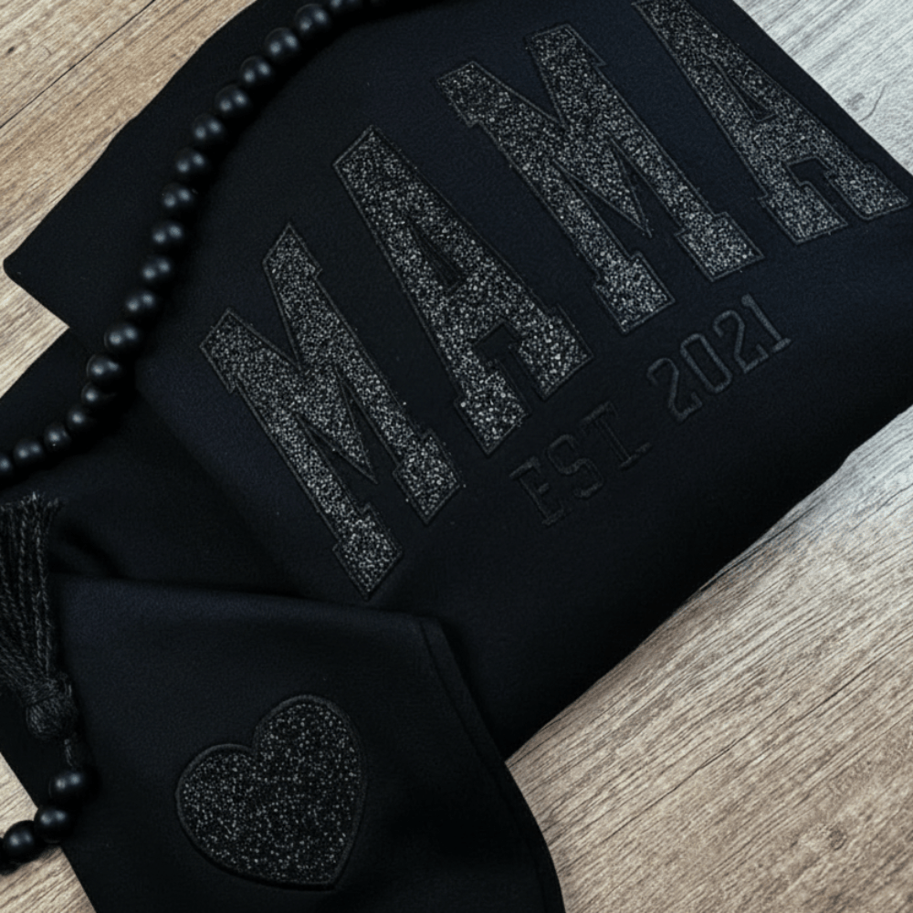 Personalized sweatshirt featuring custom name embroidery and subtle shimmer detail, designed for soft everyday wear. 1
