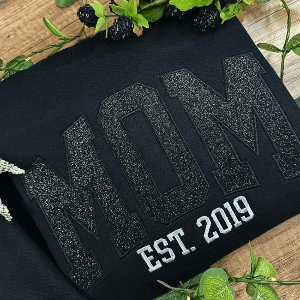 Personalized sweatshirt featuring custom name embroidery and subtle shimmer detail, designed for soft everyday wear. 2