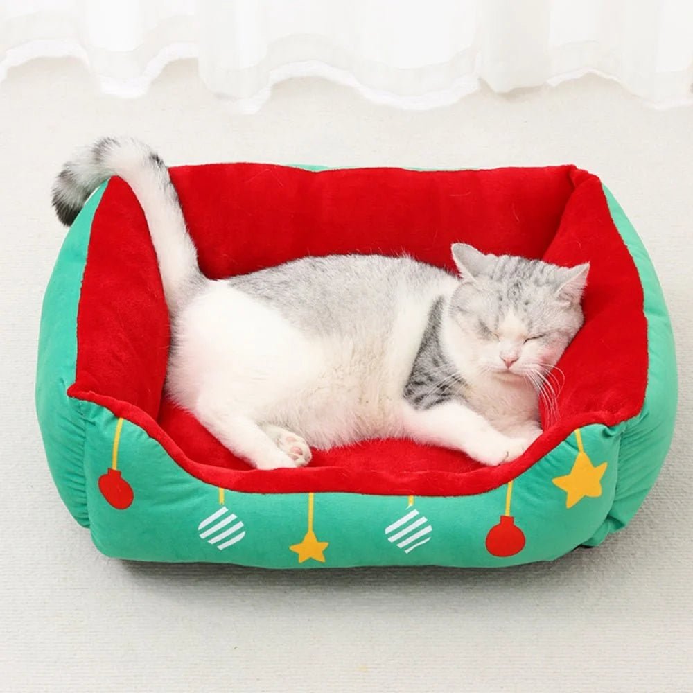 Cozy semi-enclosed pet bed for cats and small dogs, designed as a Christmas retreat with a non-slip base for stability. 2