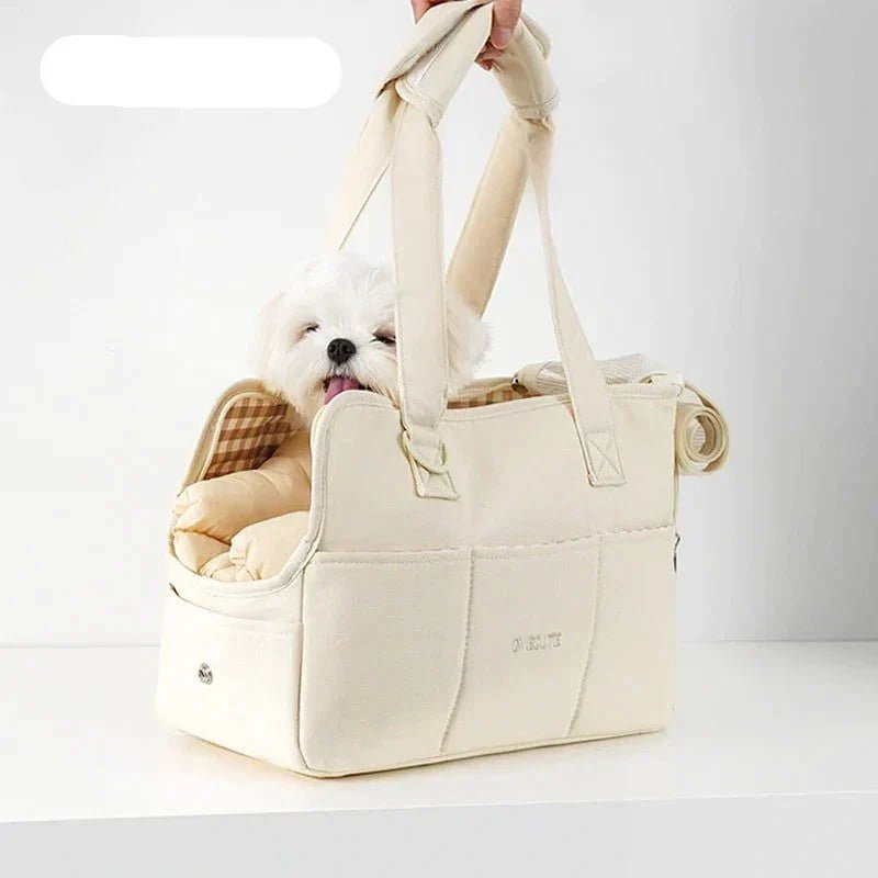 Lightweight pet carrier for cats and small dogs made from breathable cotton material, featuring a compact design ideal for travel. 3