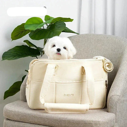 Lightweight pet carrier for cats and small dogs made from breathable cotton material, featuring a compact design ideal for travel. 4