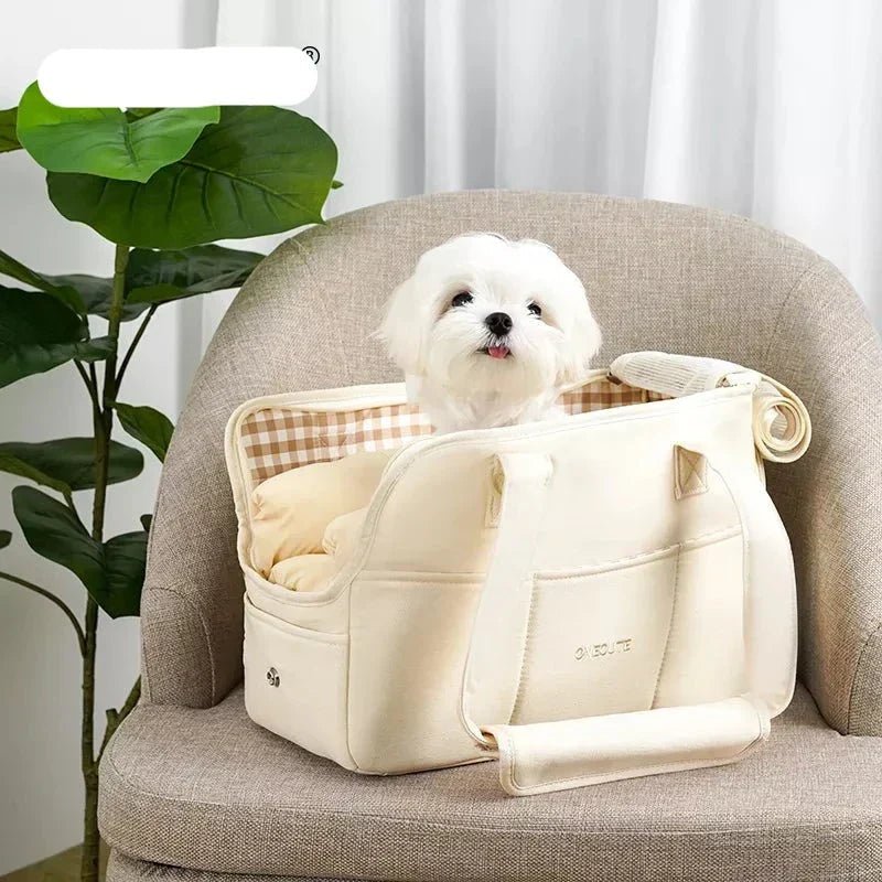 Lightweight pet carrier for cats and small dogs made from breathable cotton material, featuring a compact design ideal for travel. 1