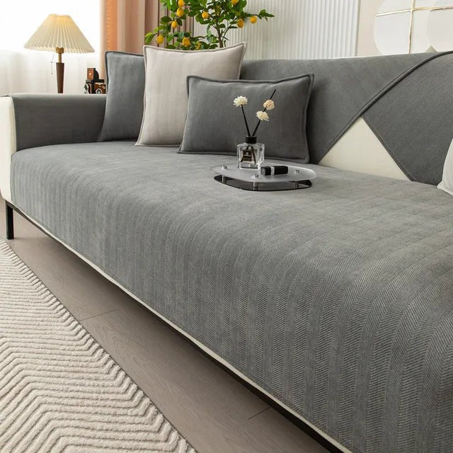 Pet-friendly sofa cover featuring a non-slip bottom, made from durable washable fabric, designed for stain and scratch protection, ideal for homes with pets. 0