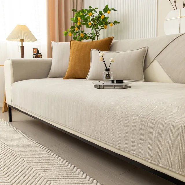 Pet-friendly sofa cover featuring a non-slip bottom, made from durable washable fabric, designed for stain and scratch protection, ideal for homes with pets. 1